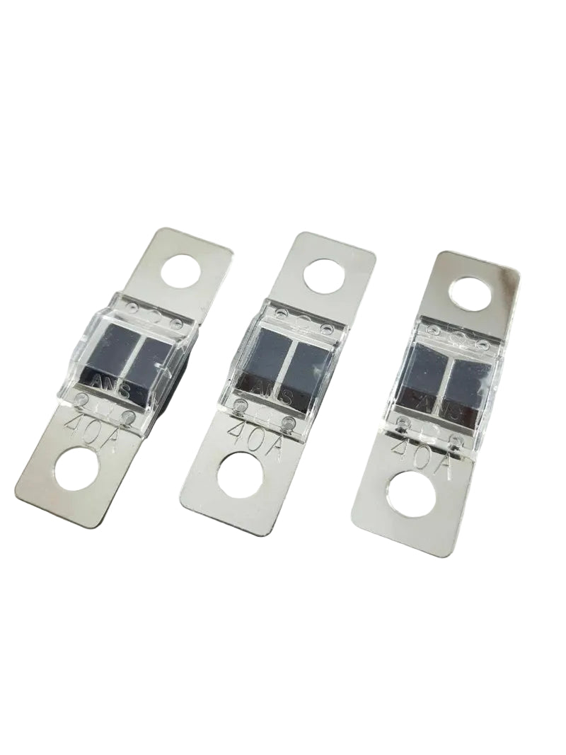 Three metallic fuses with clear plastic covers on a white background
