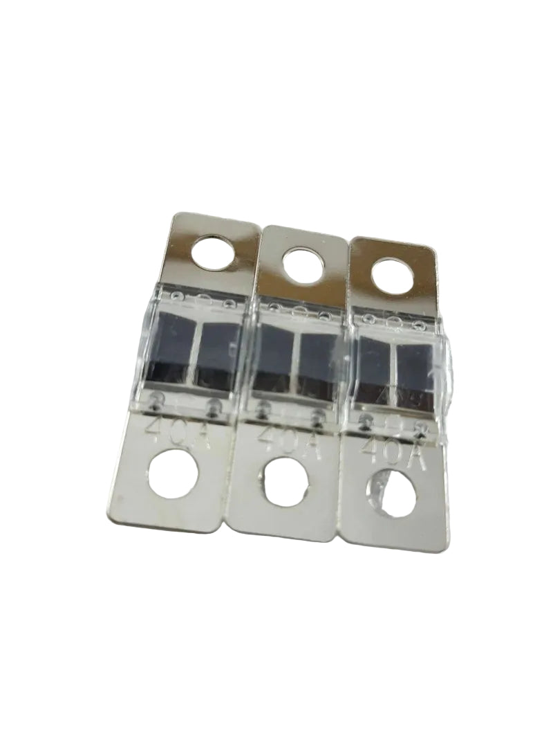 Three metallic fuses on a textured gray background