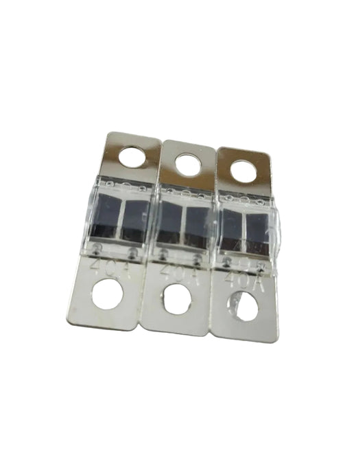Three metallic fuses on a textured gray background