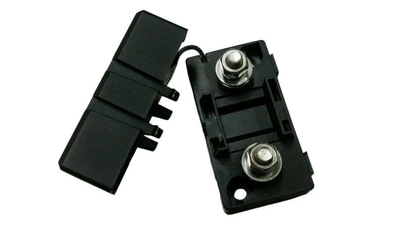 Two black battery terminals with metal connectors on a light gray background