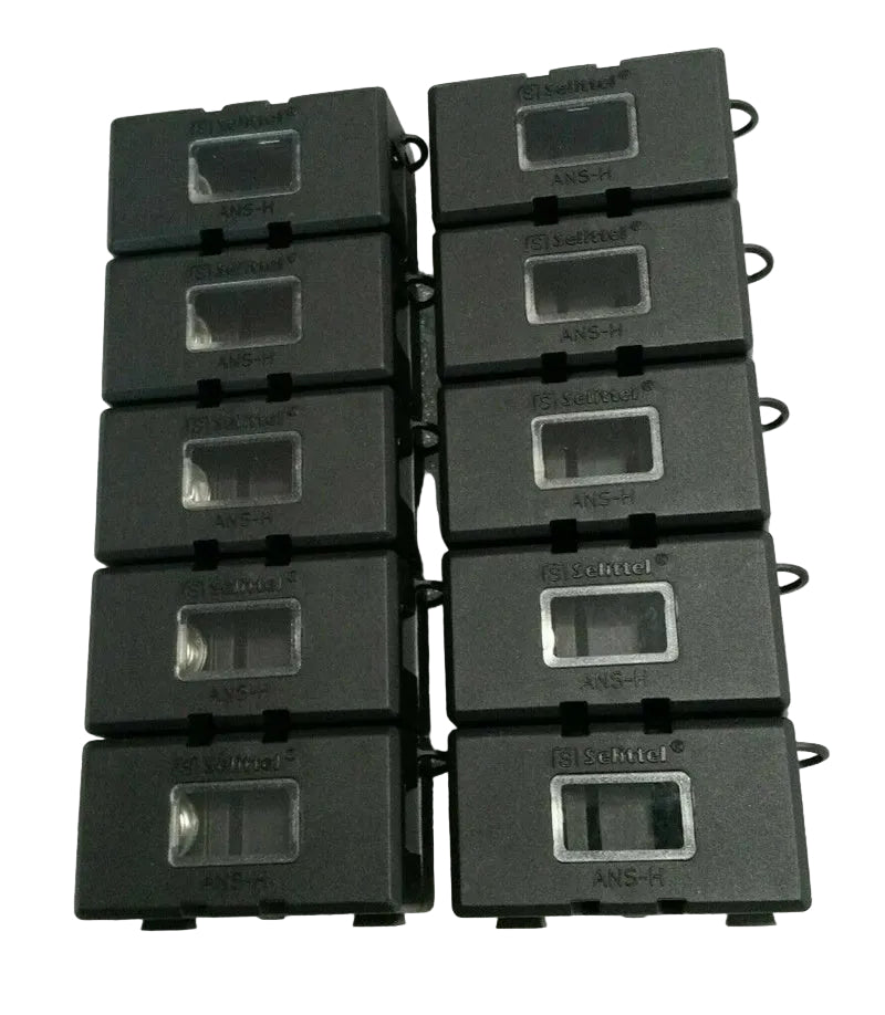 Nine black cassette tapes stacked on a white background